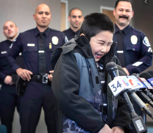 Police in awe as a kid entertains them in California. (Credit: Google)